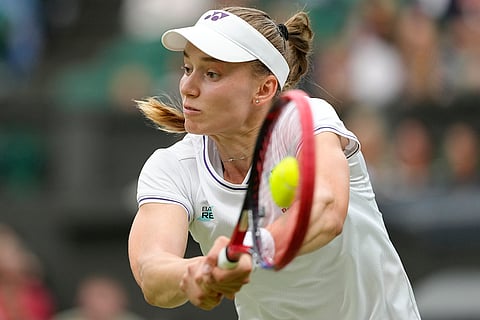 Elena Rybakina plays a backhand return to Anna Kalinskaya